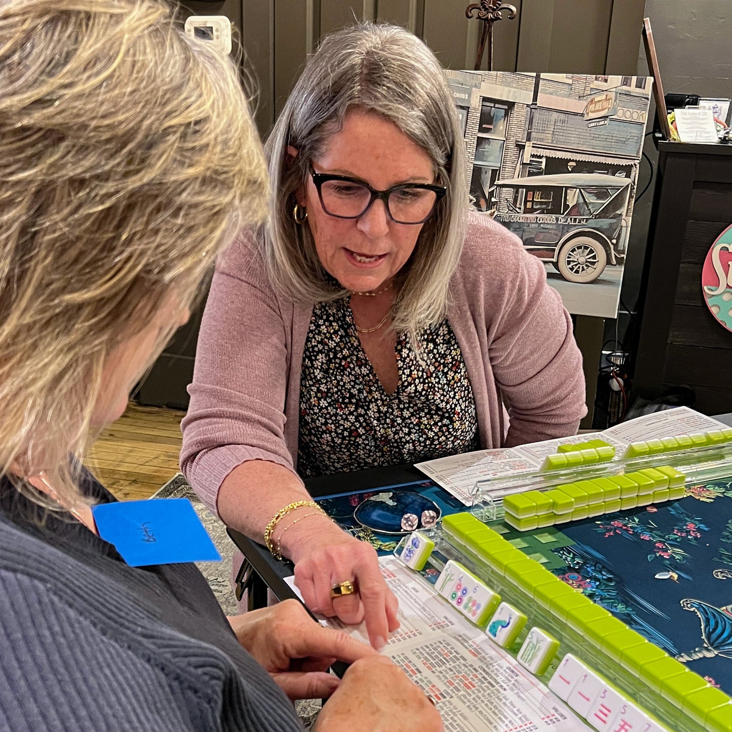 Two women playing mahjong together